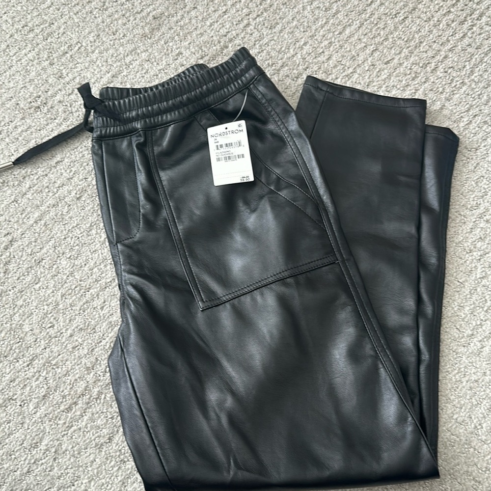Blank NYC size 26 NWT black faux leather straight legged. Ankle length
